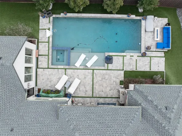 an aerial view of a house with swimming pool