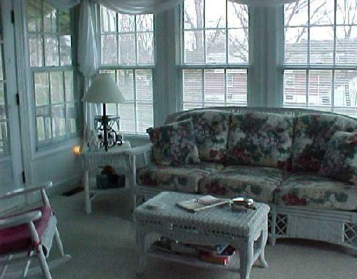 5202 Rosecliff Road Roanoke, VA 24018 - Photo 4 of 4 a living room with furniture and a floor to ceiling window
