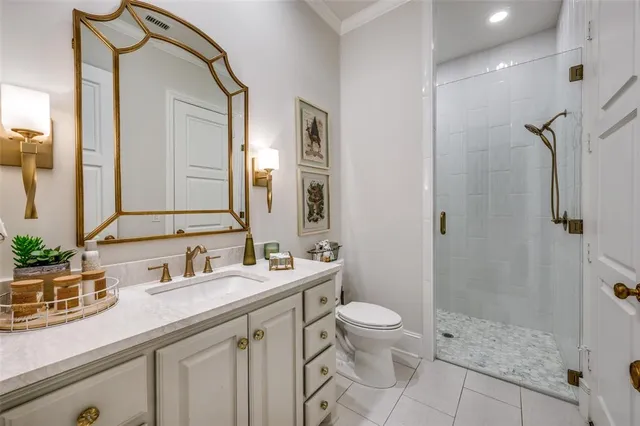 a bathroom with a granite countertop sink mirror toilet and shower