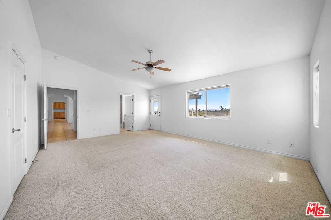 11635 Lebec Road Phelan, CA 92371 - Photo 16 of 35 an empty room with a empty space and windows