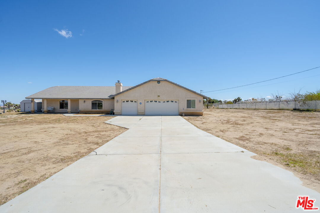11635 Lebec Road Phelan, CA 92371 - Photo 2 of 35 a front view of a house with a yard