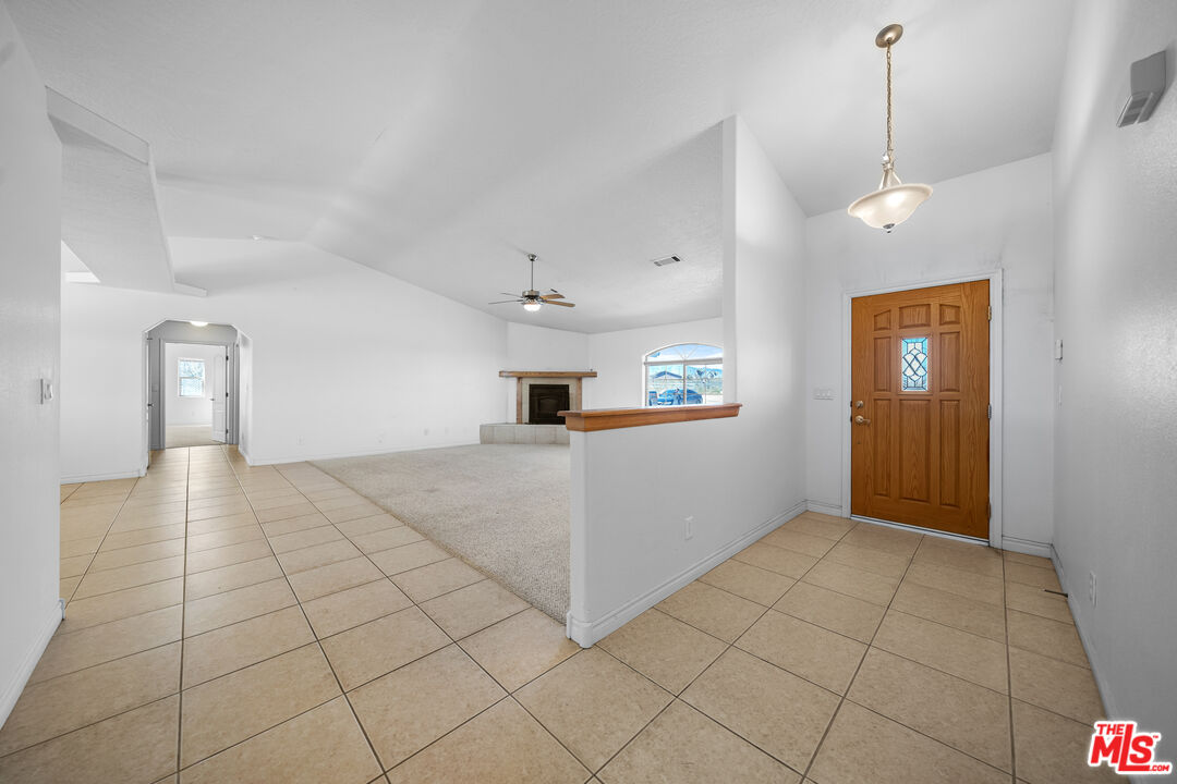 11635 Lebec Road Phelan, CA 92371 - Photo 7 of 35 a view of a kitchen with furniture and an empty room