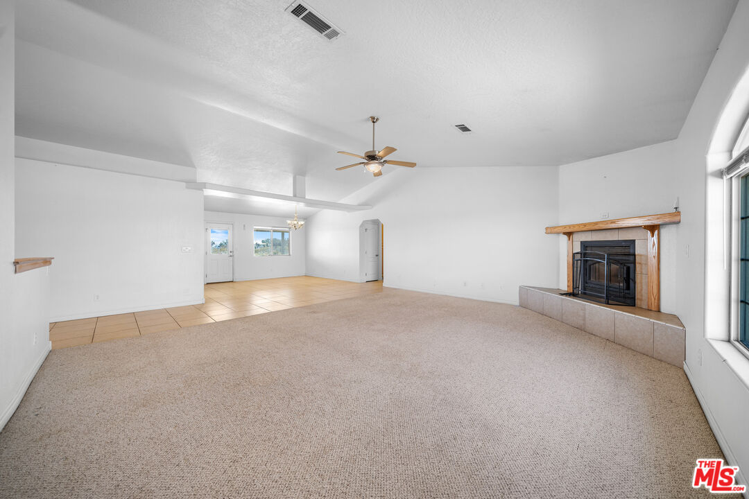 11635 Lebec Road Phelan, CA 92371 - Photo 9 of 35 a view of empty room with a fireplace