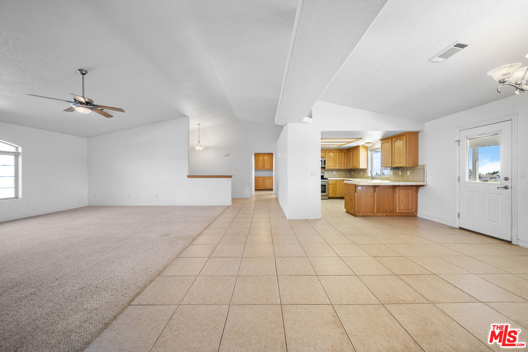 11635 Lebec Road Phelan, CA 92371 - Photo 10 of 35 a view of a kitchen with furniture and cabinets