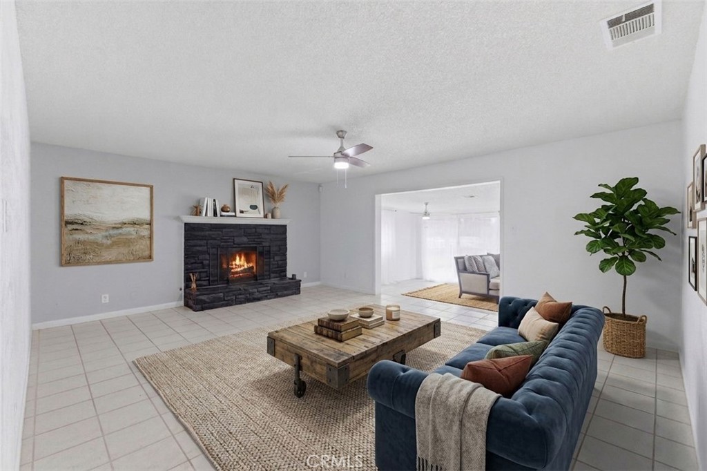 96 West Repplier Road Banning, CA 92220 - Photo 12 of 53 AI rendering of reimagined living room. Flame digitally added