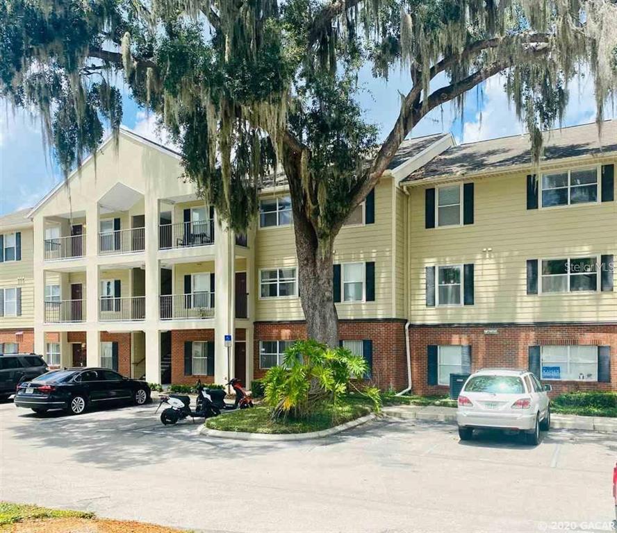 2360 Southwest Archer Road, Unit 903 Gainesville, FL 32608 - Photo 1 of 1 a car parked in front of a building