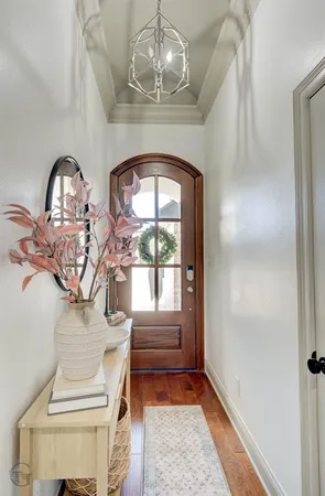 a view of entryway with a chandelier