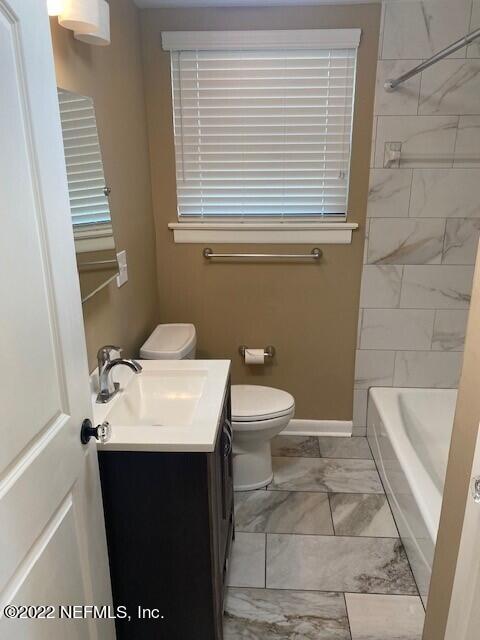 1789 River Road, Unit 2 Jacksonville, FL 32207 - Photo 12 of 22 a bathroom with a sink and a toilet