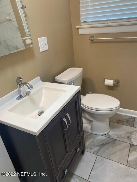 1789 River Road, Unit 2 Jacksonville, FL 32207 - Photo 14 of 22 a bathroom with a sink and a toilet