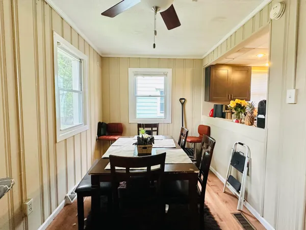 a dining room with furniture and window