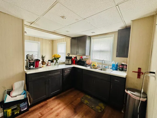 a kitchen with sink cabinets and window