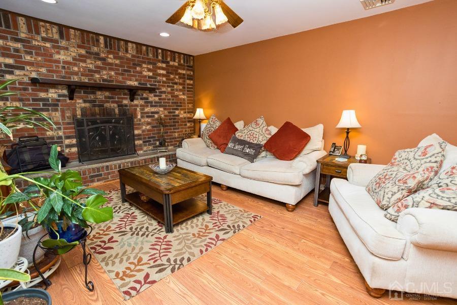 17 Ridgewood Avenue Monroe Township, NJ 08831 - Photo 7 of 16 a living room with furniture and a potted plant