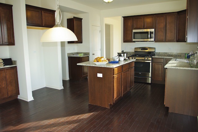 681 Ridgeview Lane Sugar Grove, IL 60554 - Photo 8 of 19 a kitchen with stainless steel appliances granite countertop a stove a sink and a microwave