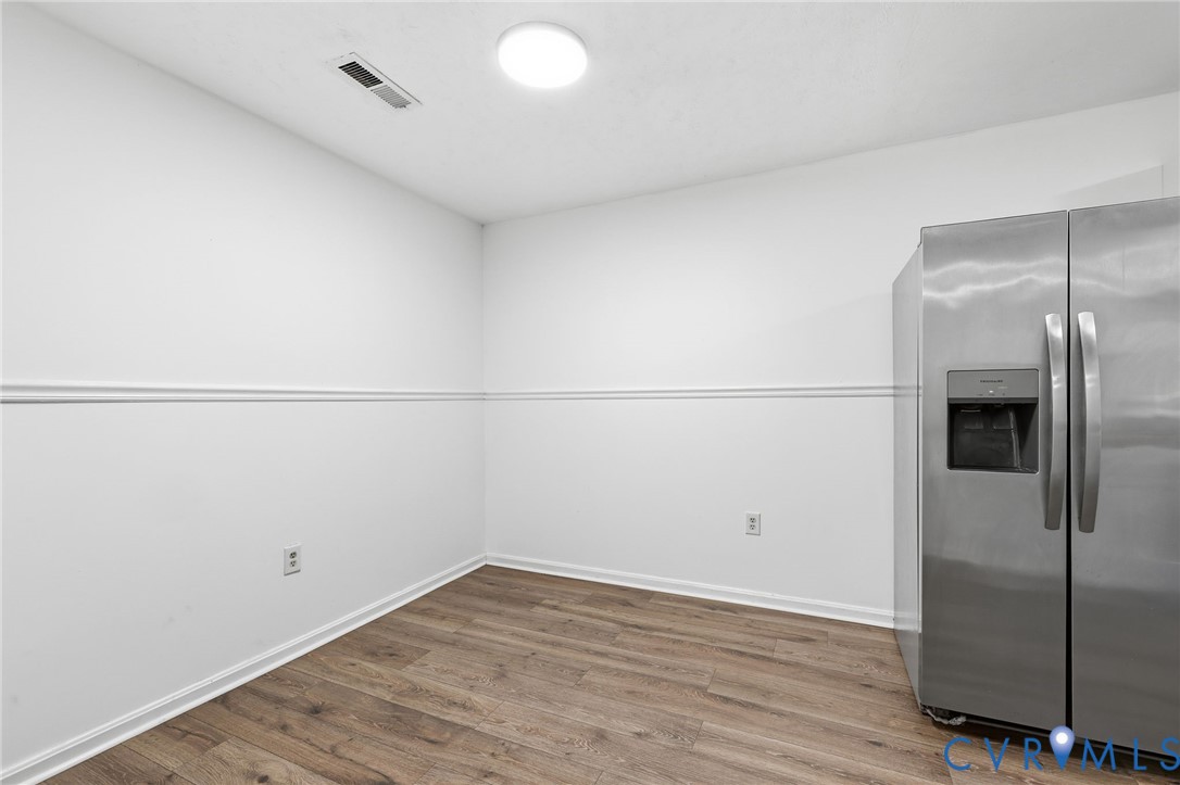 3220 Greenway Road Gladstone, VA 24553 - Photo 9 of 29 a view of a refrigerator in kitchen and an empty room