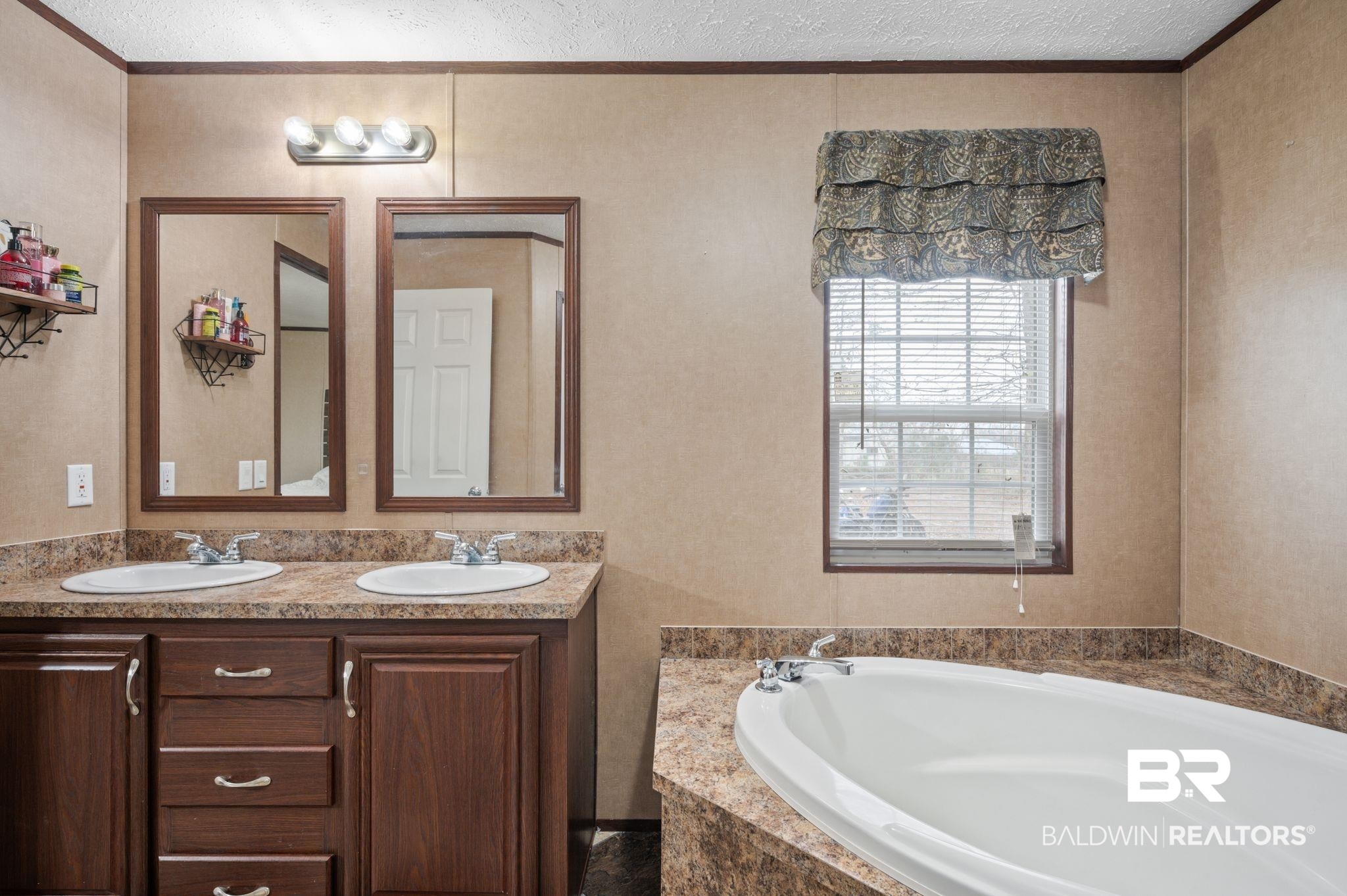 39908 T A Chastang Road Bay Minette, AL 36507 - Photo 12 of 20 Full bathroom with a textured ceiling, double vanity, and a sink