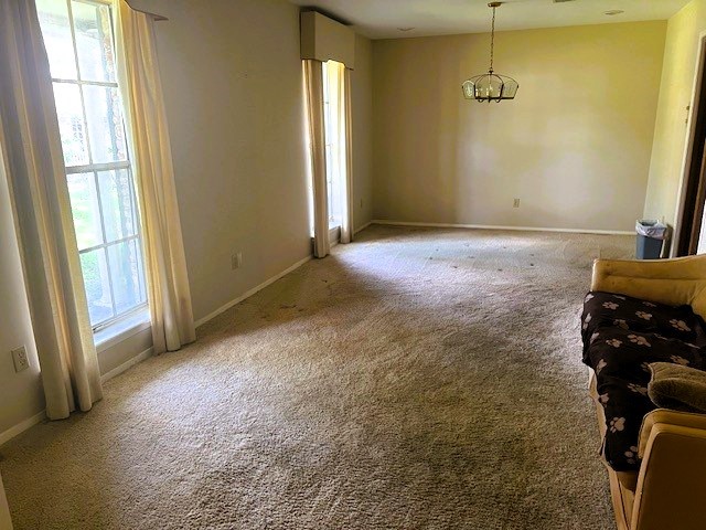 8639 Cedarbrake Drive Spring Valley Village, TX 77055 - Photo 3 of 26 This inviting space seamlessly combines a formal living area and dining room, offering an elegant setting for both relaxation and entertaining.