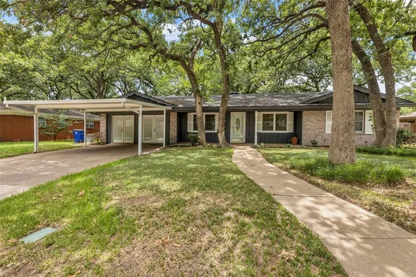 front view of a house with a yard