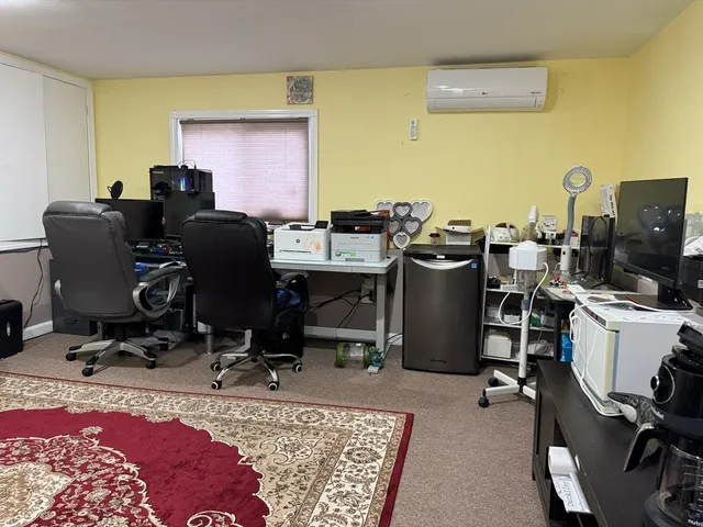 a view of a workspace with furniture and a couch