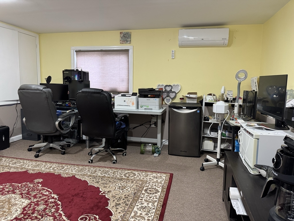 47 Shawmut Street Revere, MA 02151 - Photo 17 of 36 a view of a workspace with furniture and a couch