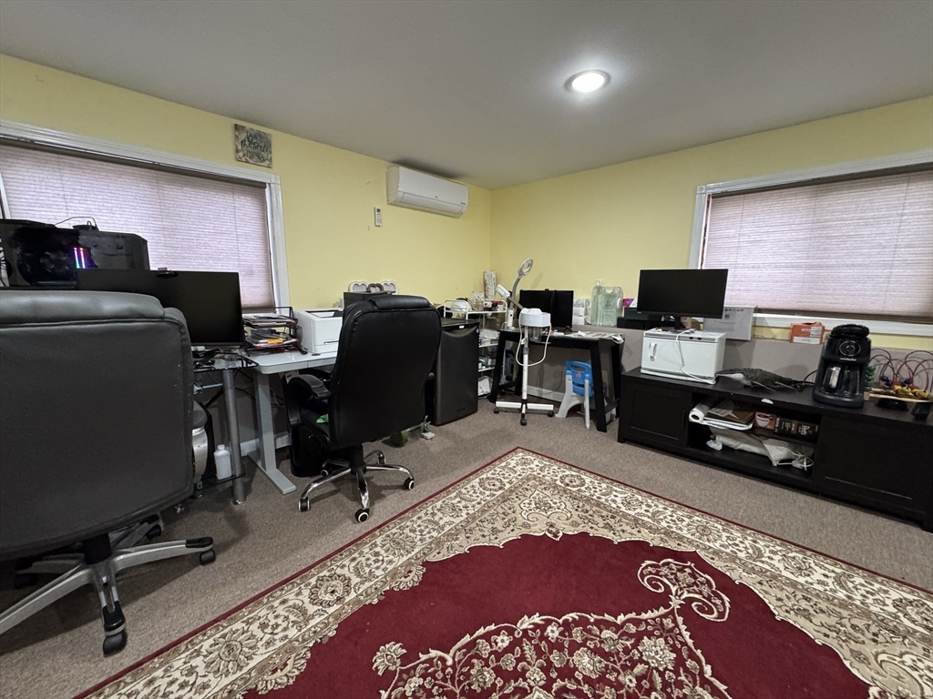 47 Shawmut Street Revere, MA 02151 - Photo 18 of 36 a workspace with furniture and a rug