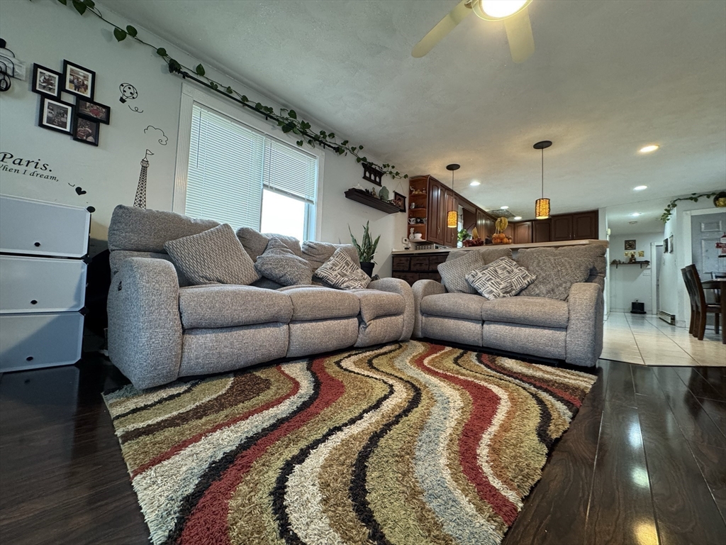 47 Shawmut Street Revere, MA 02151 - Photo 2 of 36 a living room with furniture and a rug