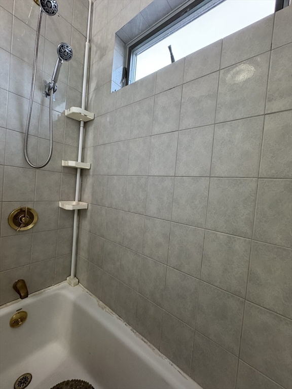 47 Shawmut Street Revere, MA 02151 - Photo 21 of 36 a bathroom with a bath tub with a shower