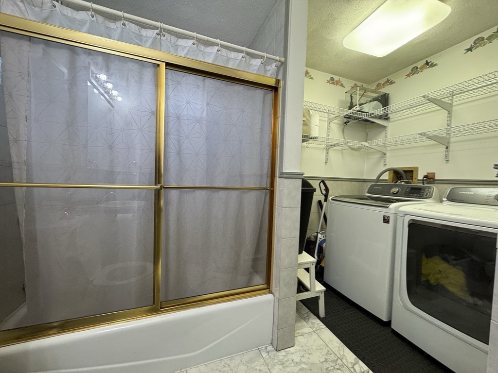 47 Shawmut Street Revere, MA 02151 - Photo 22 of 36 a utility room with dryer and washer