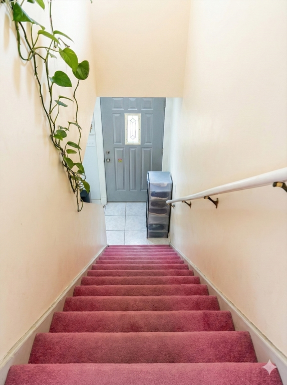 47 Shawmut Street Revere, MA 02151 - Photo 24 of 36 a bedroom with a bed and window