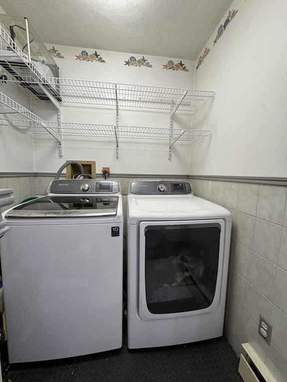 47 Shawmut Street Revere, MA 02151 - Photo 25 of 36 a utility room with dryer and washer