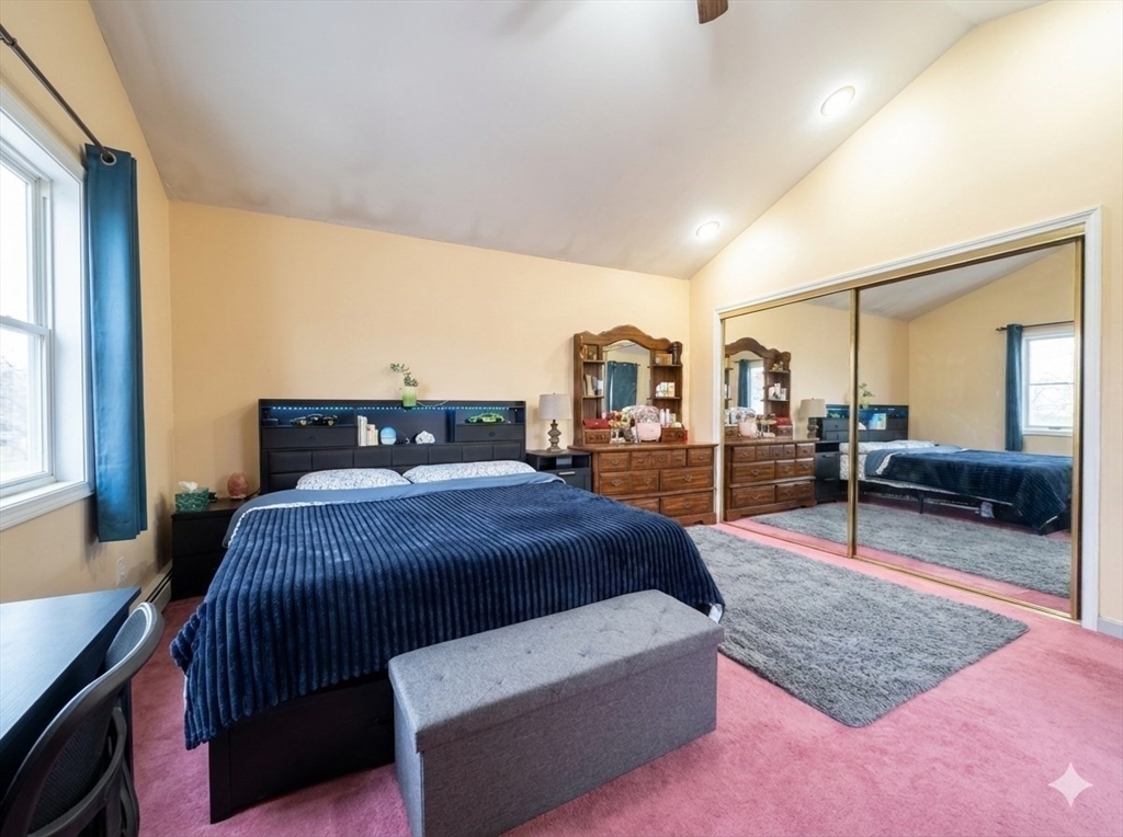 47 Shawmut Street Revere, MA 02151 - Photo 10 of 36 a bedroom with a bed a table and window