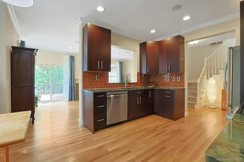 a bathroom with a granite countertop sink tub and mirror