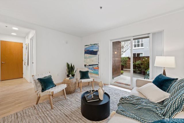 a living room with furniture and a table