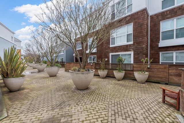 a view of a patio with a yard