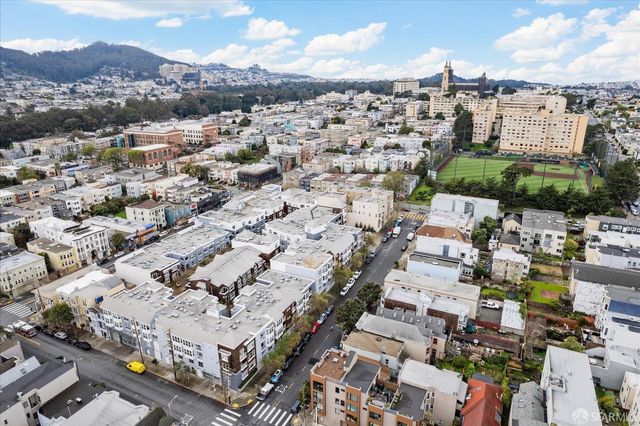 a view of swimming pool with outdoor seating and trees