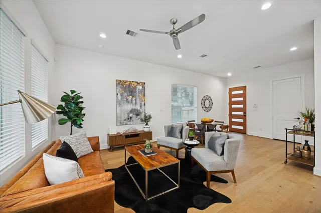 a view of a dining room with furniture and wooden floor