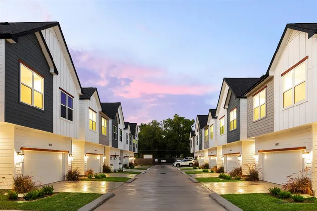 a view of a building with a yard