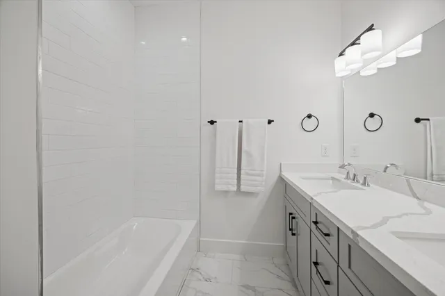 a view of bathroom with marble wall