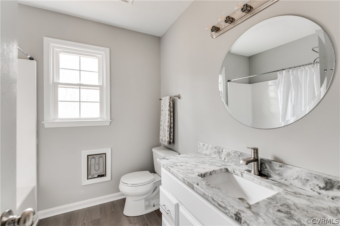 15615 Roland View Drive Chester, VA 23831 - Photo 24 of 35 a bathroom with a granite countertop toilet sink and mirror
