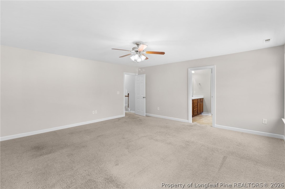 50 Huzzas Circle Cameron, NC 28326 - Photo 19 of 39 a view of an empty room with a ceiling fan