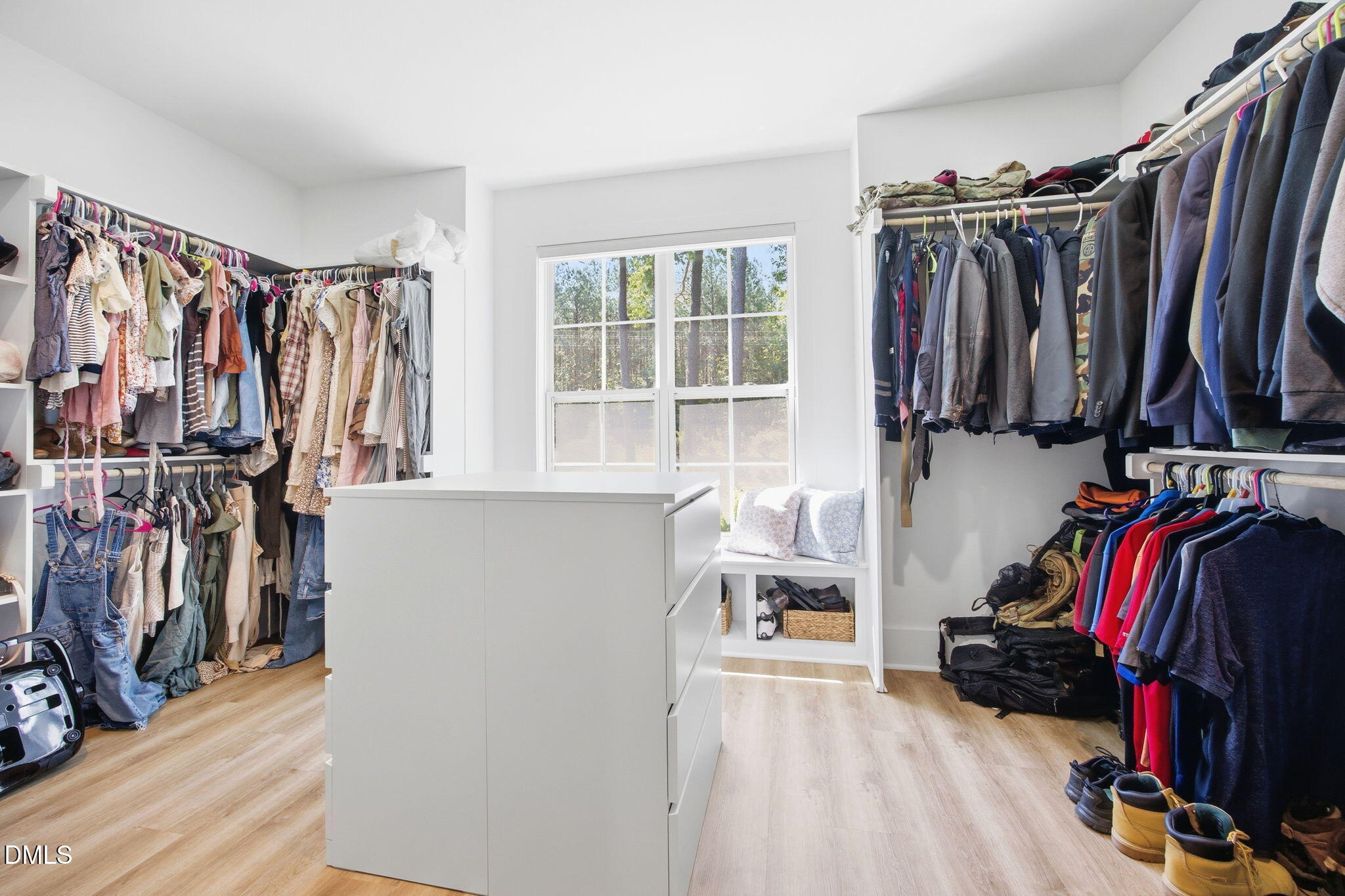 3511 Bruce Garner Road Wake Forest, NC 27587 - Photo 24 of 56 a view of walk in closet with clothes and shoes