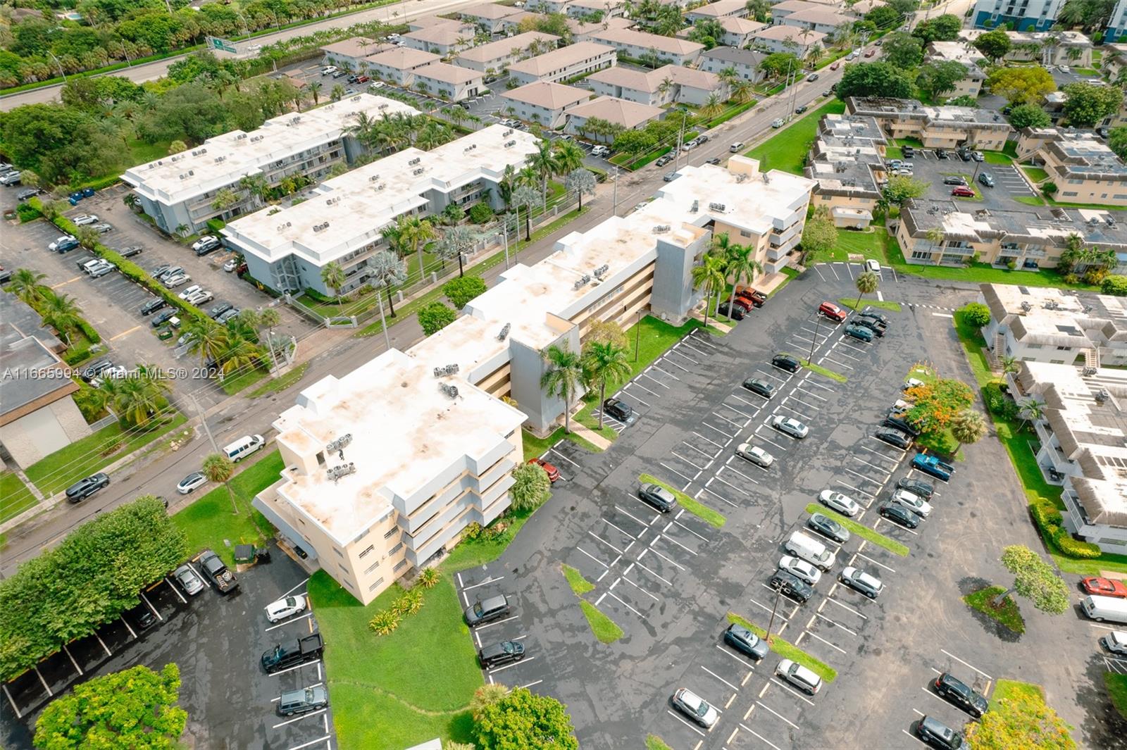 7410 Southwest 82nd Street, Unit K302 Miami, FL 33143 - Photo 26 of 34 an aerial view of residential houses with outdoor space