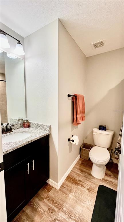 13486 English Sparrow Road Weeki Wachee, FL 34614 - Photo 28 of 51 a bathroom with a sink toilet and mirror