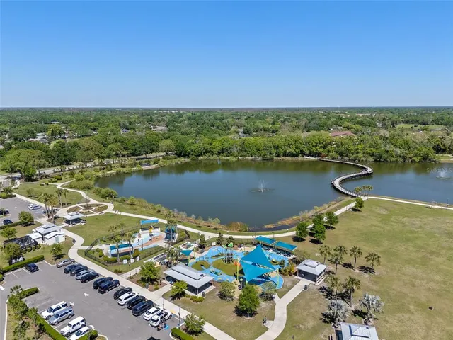 an aerial view of lake residential house with outdoor space and seating