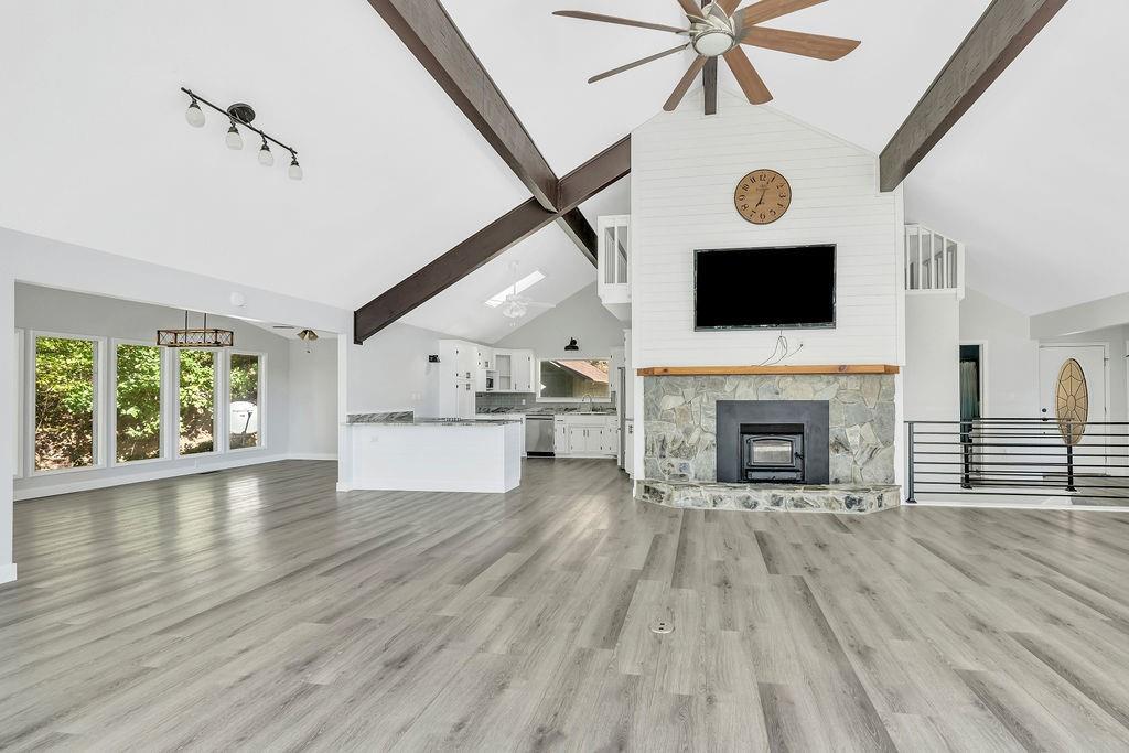 357 John's Way Talking Rock, GA 30175 - Photo 11 of 63 a view of empty room with wooden floor and fireplace