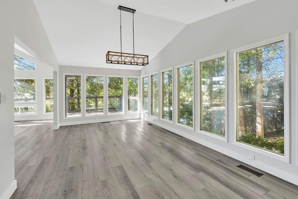 357 John's Way Talking Rock, GA 30175 - Photo 13 of 63 a view of an empty room with wooden floor and a window
