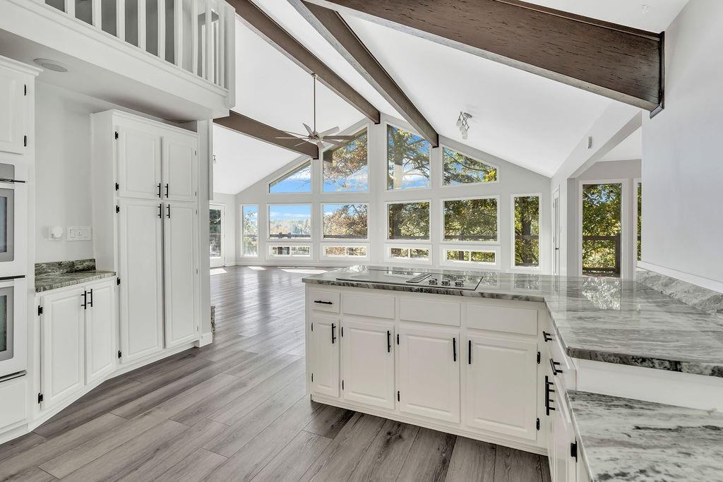 357 John's Way Talking Rock, GA 30175 - Photo 19 of 63 a bathroom with a granite countertop sink and a large mirror