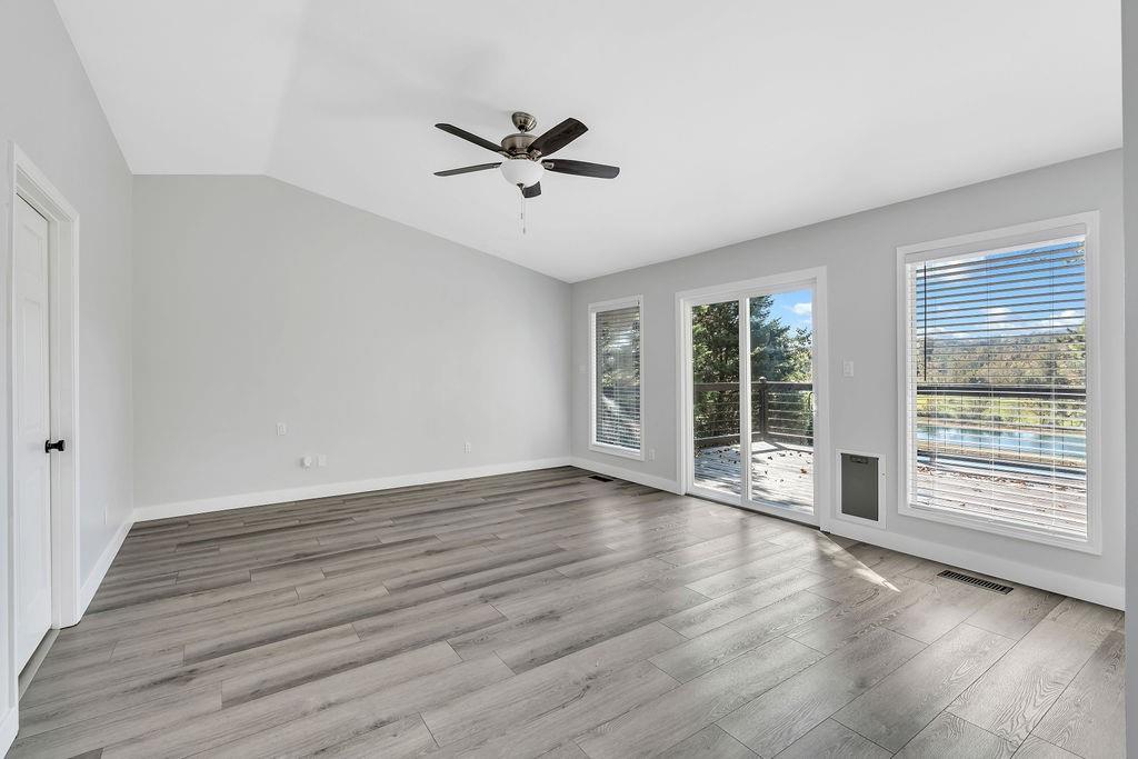 357 John's Way Talking Rock, GA 30175 - Photo 21 of 63 a view of an empty room with wooden floor and a window