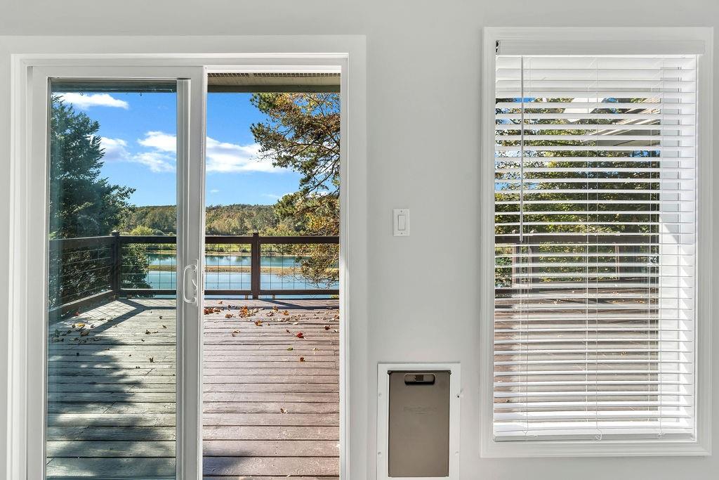 357 John's Way Talking Rock, GA 30175 - Photo 23 of 63 a view of a glass door and a yard from a living room