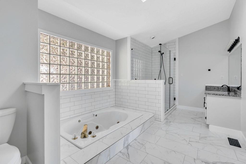 357 John's Way Talking Rock, GA 30175 - Photo 25 of 63 a bathroom with a bathtub and a toilet