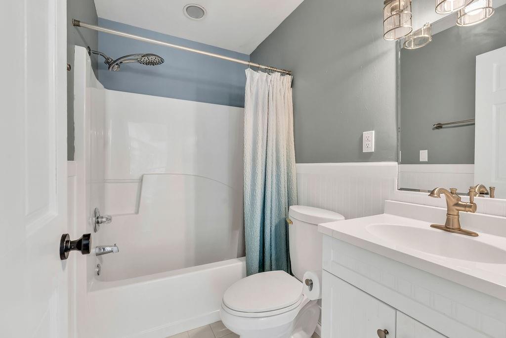 357 John's Way Talking Rock, GA 30175 - Photo 33 of 63 a bathroom with a sink a toilet a mirror and shower